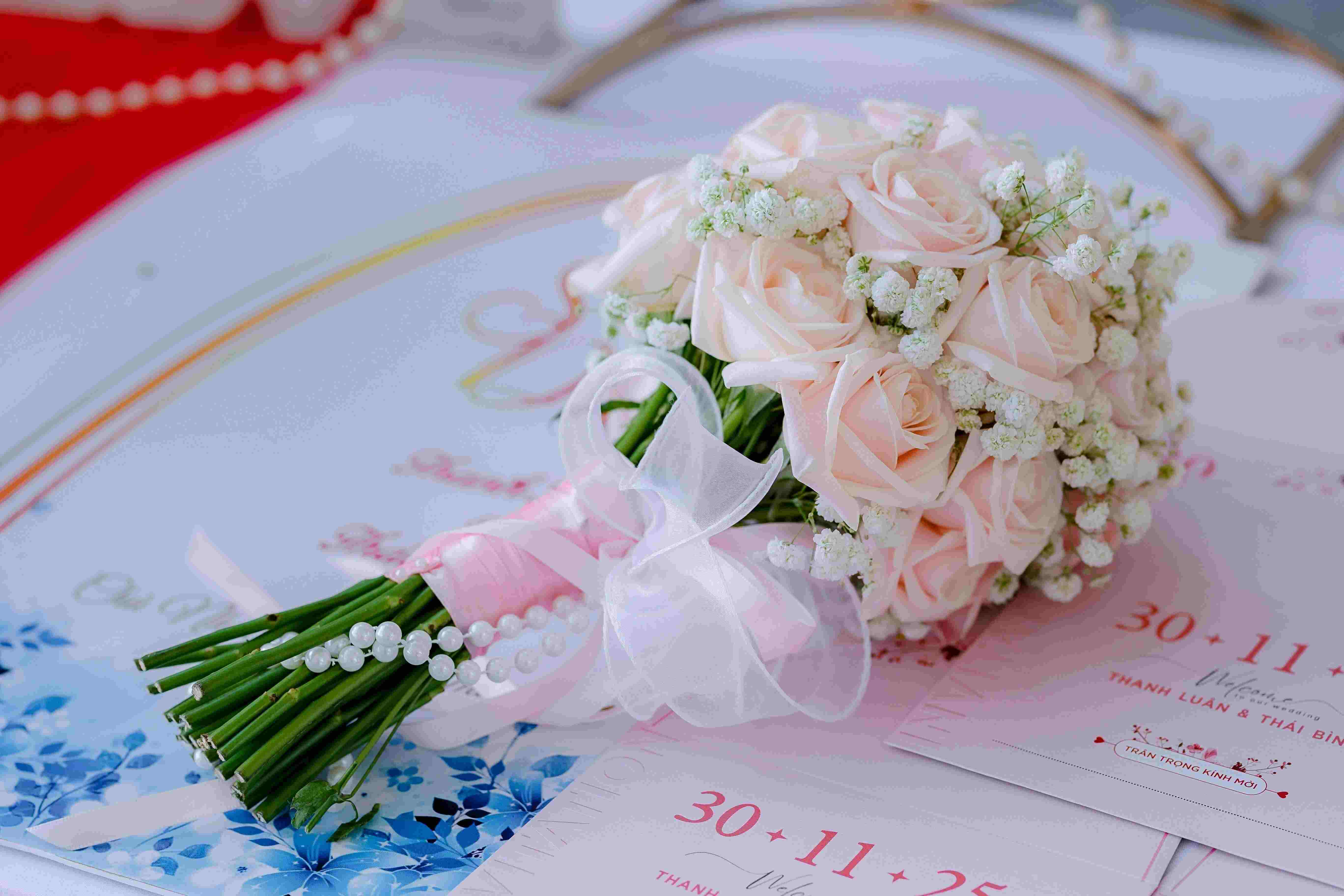 Elegant wedding bouquet with white roses and greenery